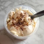 The Ultimate Guide to Ninja Creami Recipes: Delicious & Easy Ideas for Every Taste 9 Creamy vanilla Ninja Creami recipe topped with chocolate shavings