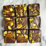 Pistachio Chocolate Bar: The Ultimate Nutty-Choco Treat You Need to Taste 9 Homemade pistachio chocolate bars with tahini swirls and roasted pistachios on top