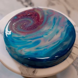 mirror glaze cake galaxy design on marble counter