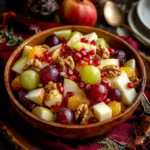 Colorful fall fruit salad with apples, pears, grapes, and pomegranate, perfect for Thanksgiving.