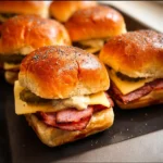 Fried bologna sliders with Pickle Dijonnaise on a serving platter