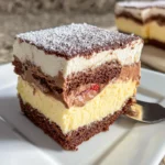 Italian Love Cake drizzled with lemon glaze and garnished with almonds