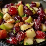 Cinnamon apple grape salad in a white bowl