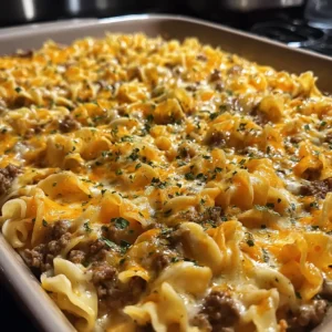 Baked Sour Cream Beef Noodle Casserole in a golden brown dish