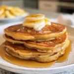 Fluffy cottage cheese pancakes stacked on a plate