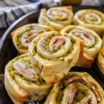 Tangy dill pickle pinwheels on a white plate