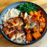 Healthy chicken and sweet potato rice bowl in a ceramic bowl