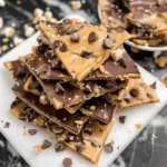 Healthy Cookie Dough Bark broken into pieces on a plate