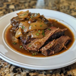 Juicy slow cooked beef brisket served with roasted vegetables and mashed potatoes