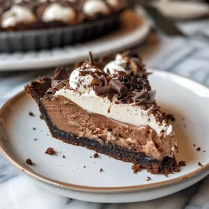 Delicious slice of Mississippi Mud Pie topped with chocolate and whipped cream.