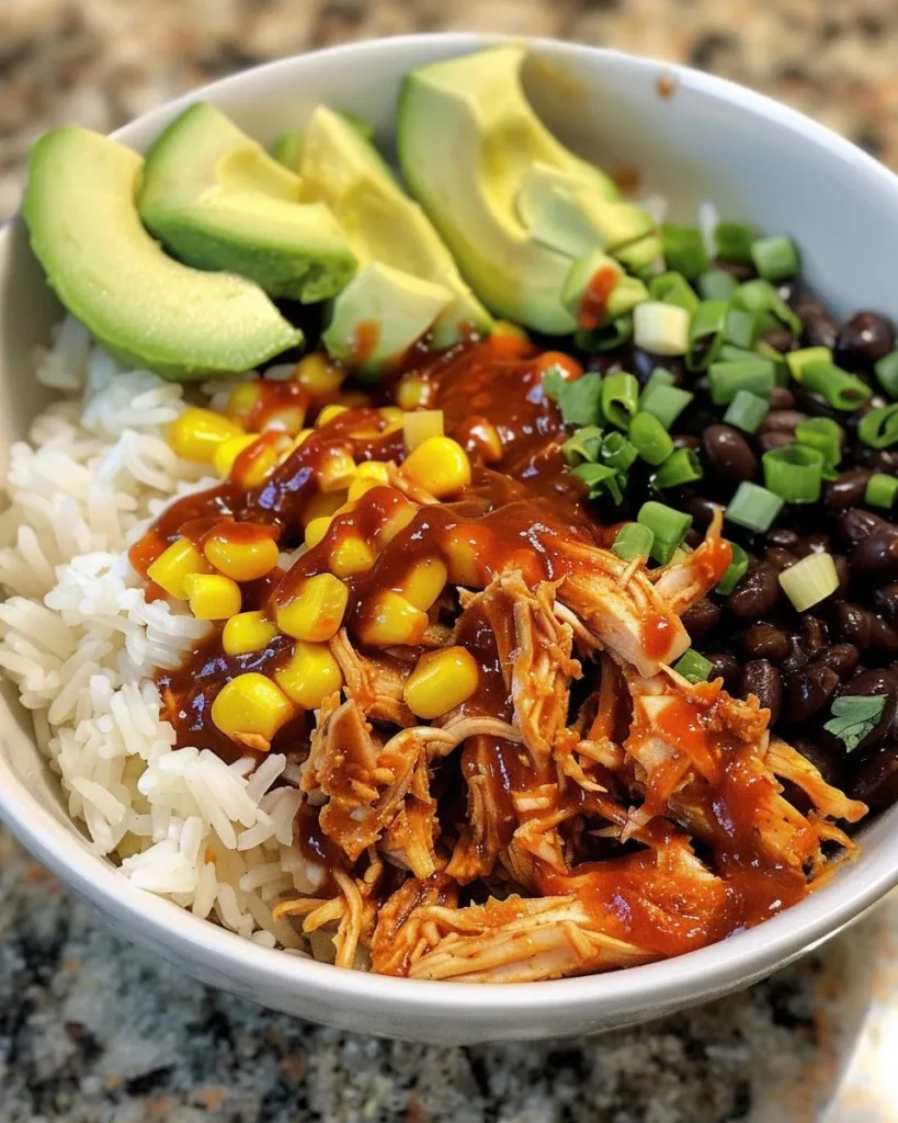BBQ Chicken Bowls 3 Delicious BBQ chicken bowl topped with fresh vegetables and savory sauce.